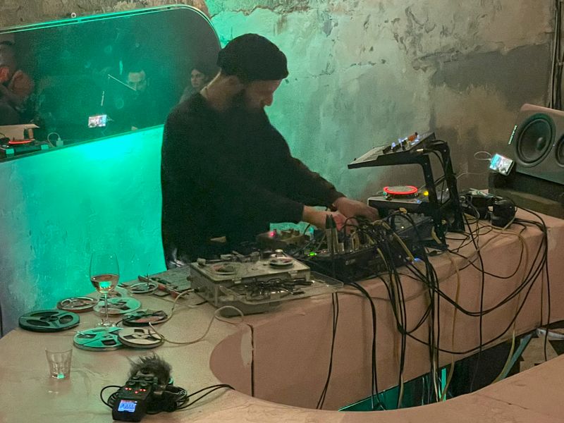 Francesco Fonassi at Dim with a reel-to-reel, a trusty CDJ-400, and an Arturia Microfreak